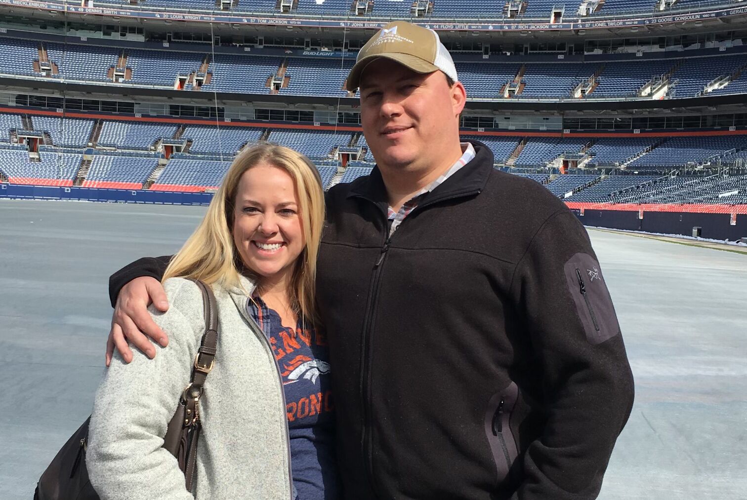 Jon Wayman poses with his fiancee at the baseball park.